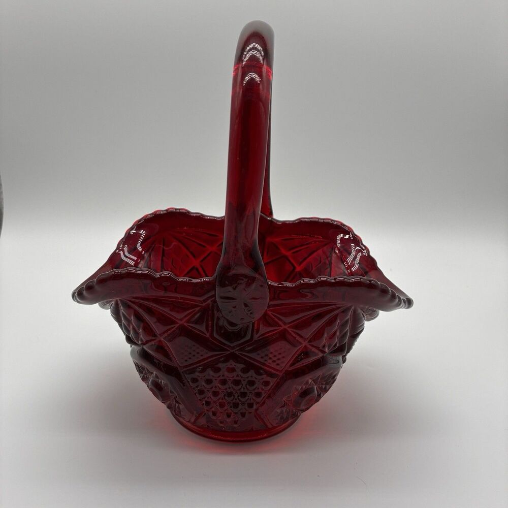 Vintage L. E. Smith Ruby Red Design cut into the basket. Measures 9.5" w/ handle